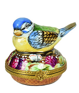 Limoges box colorful bird on nest with porcelain egg inside