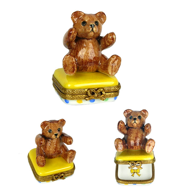 small teddy bear limoges box on colorful base