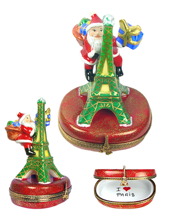 Santa climbing Eiffel Tower with gift Limoges box