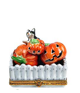 Limoges box cat with pumpkins at fence