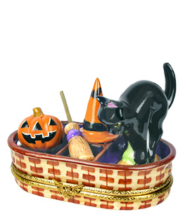 wicker basket with cat, jack-o-lantern, witch hat and broom