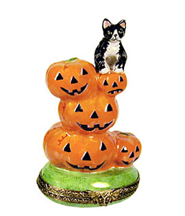 Limoges box cat on stack of Jack o lantern pumpkins