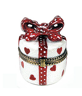 round gift with hearts decor and bow