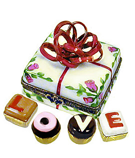 candy box with bow Limoges box with truffles spelling L-O-V-E