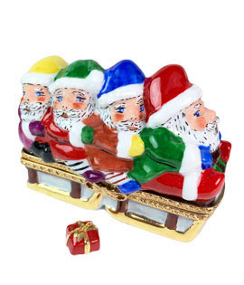 four santas on sled limoges box with gift