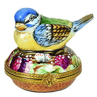 colorful bird on nest Limoges box with egg inside